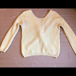 SOFT CREAM SWEATER WITH KNOT IN THE BACK DETAIL